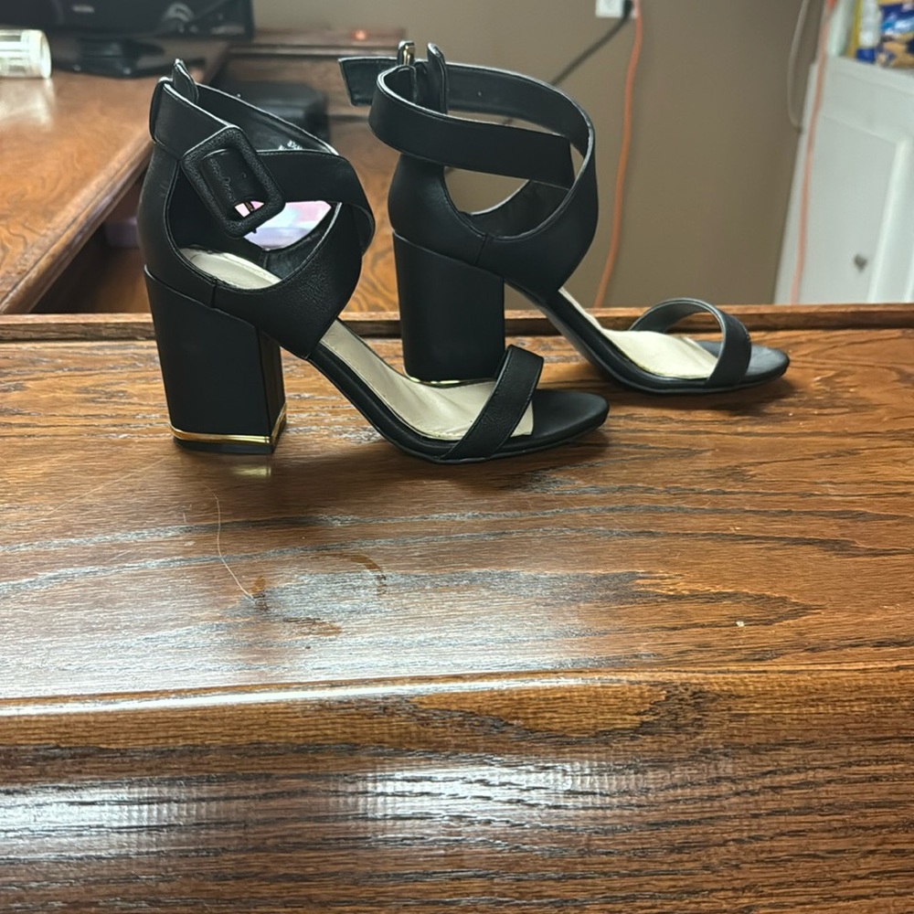 Black with gold trim blocked heel.